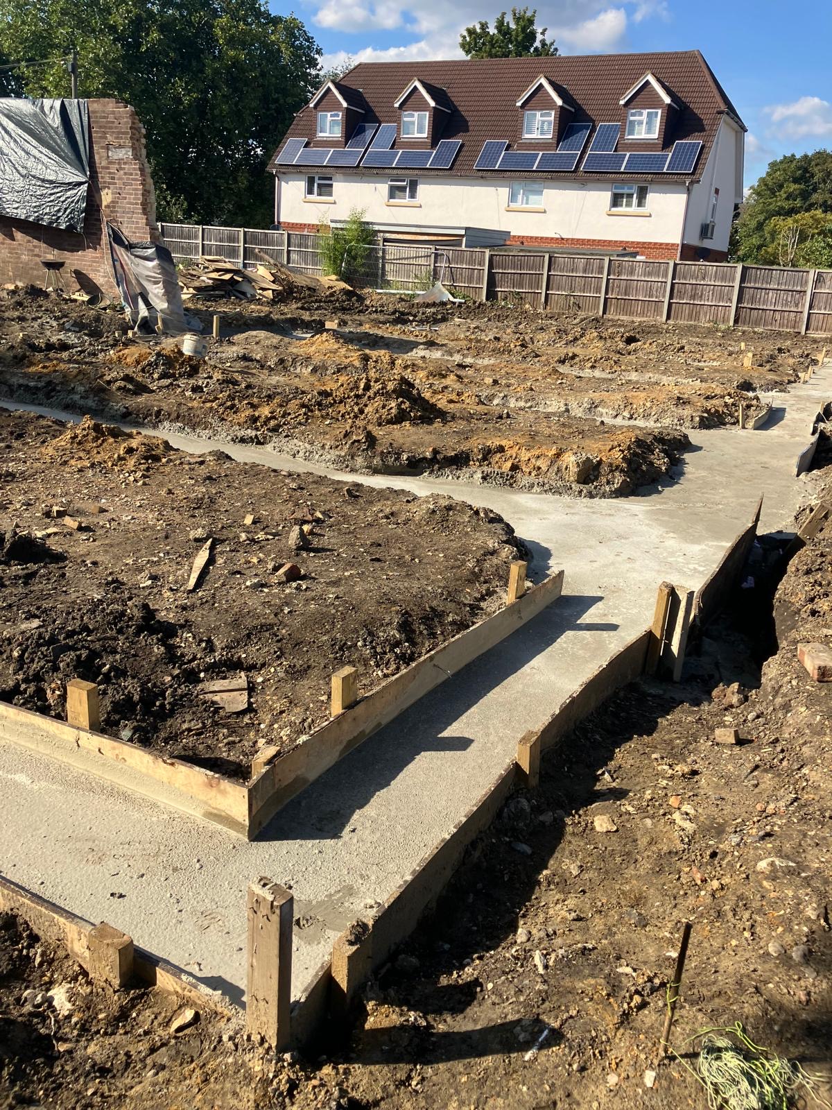 Groundworks strip footings poured 5 house terraced block